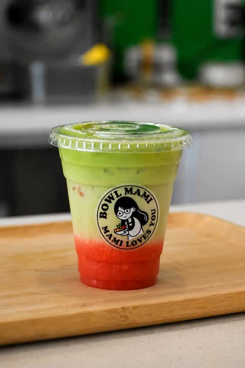 Layered green and red drink in a Bowl Mami cup
